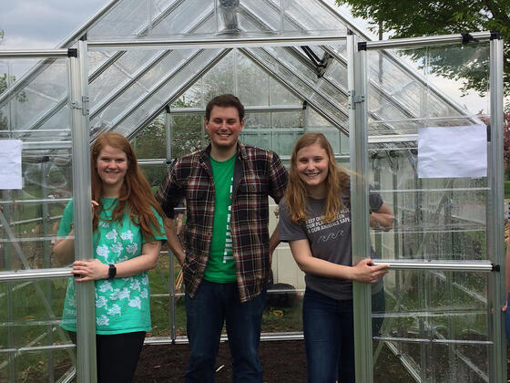 Katie Holland, Atticus Rice and Cari Witherow in McDaniel College greenhouse