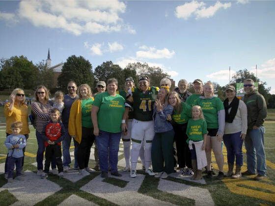 Students and family on the football field