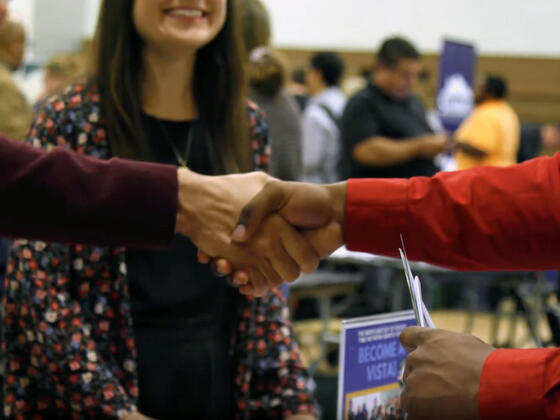 student handshake at job fair