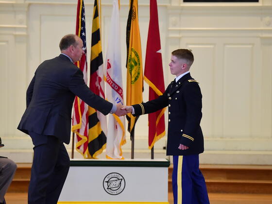 Robert Rupert shakes hands at 2022 ROTC Commissioning.