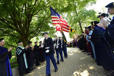 Walking the flags across campus at Commencement.