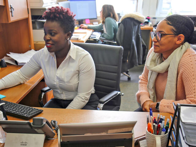 McDaniel College Financial Aid Director Kemia Himon assists Financial Aid Specialist Aza Smith