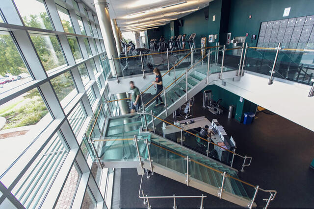 Photo from above of the staircase and equipment in Merritt Fitness Center.