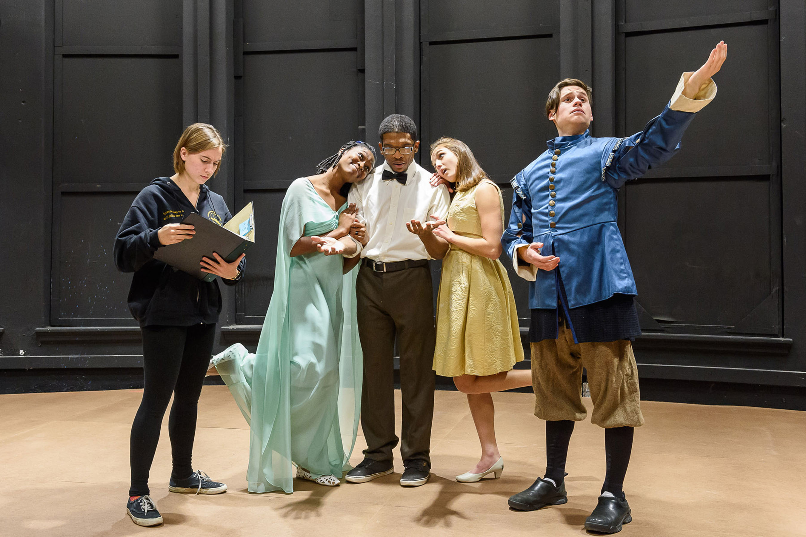 Students acting on stage.