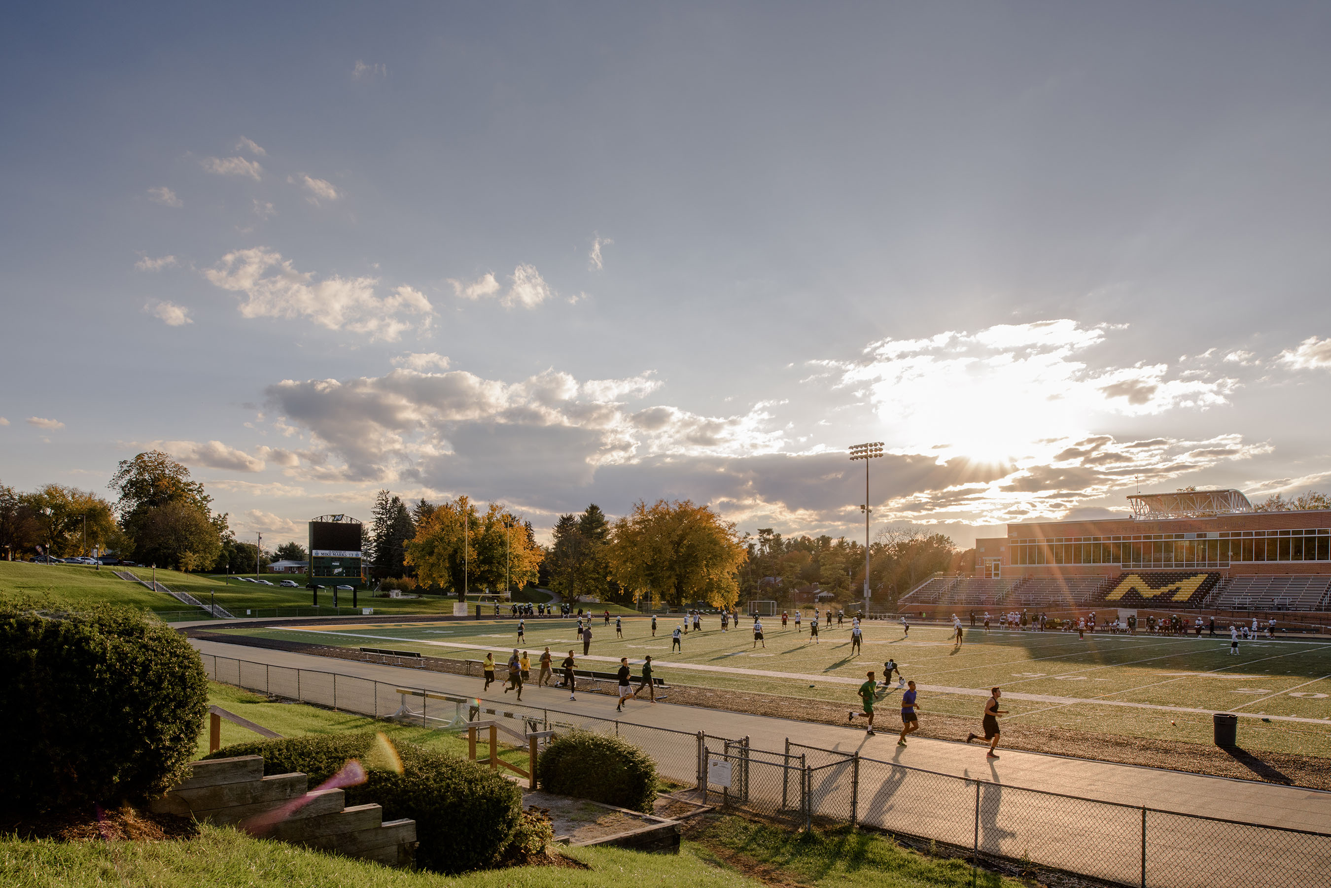 Students running around the track.
