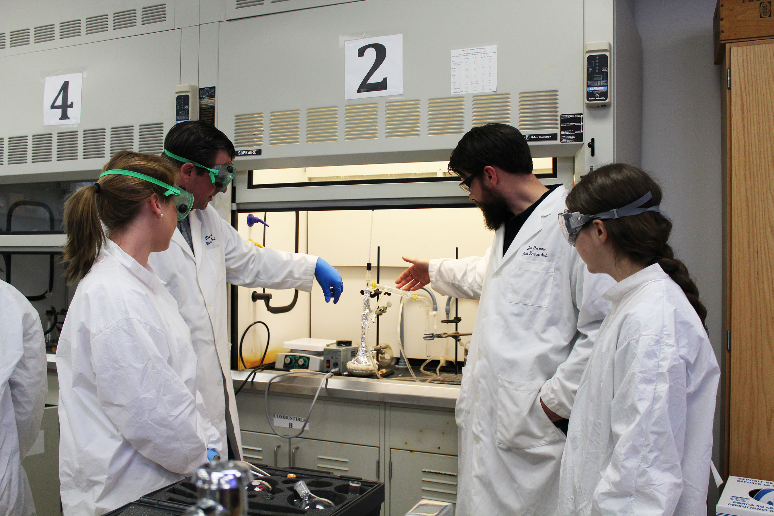 Professor and students in the chemistry lab.