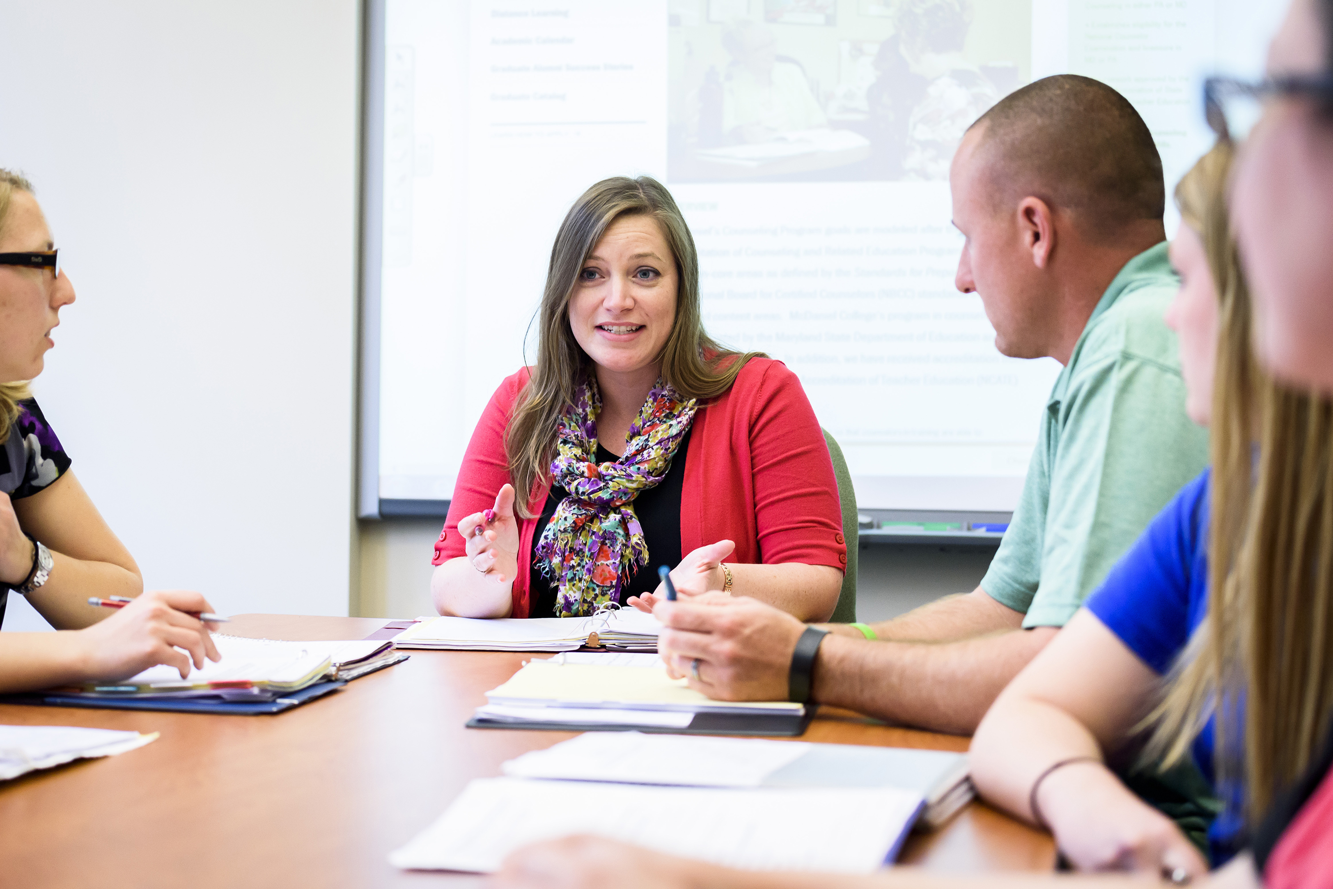 Grad students in classroom.