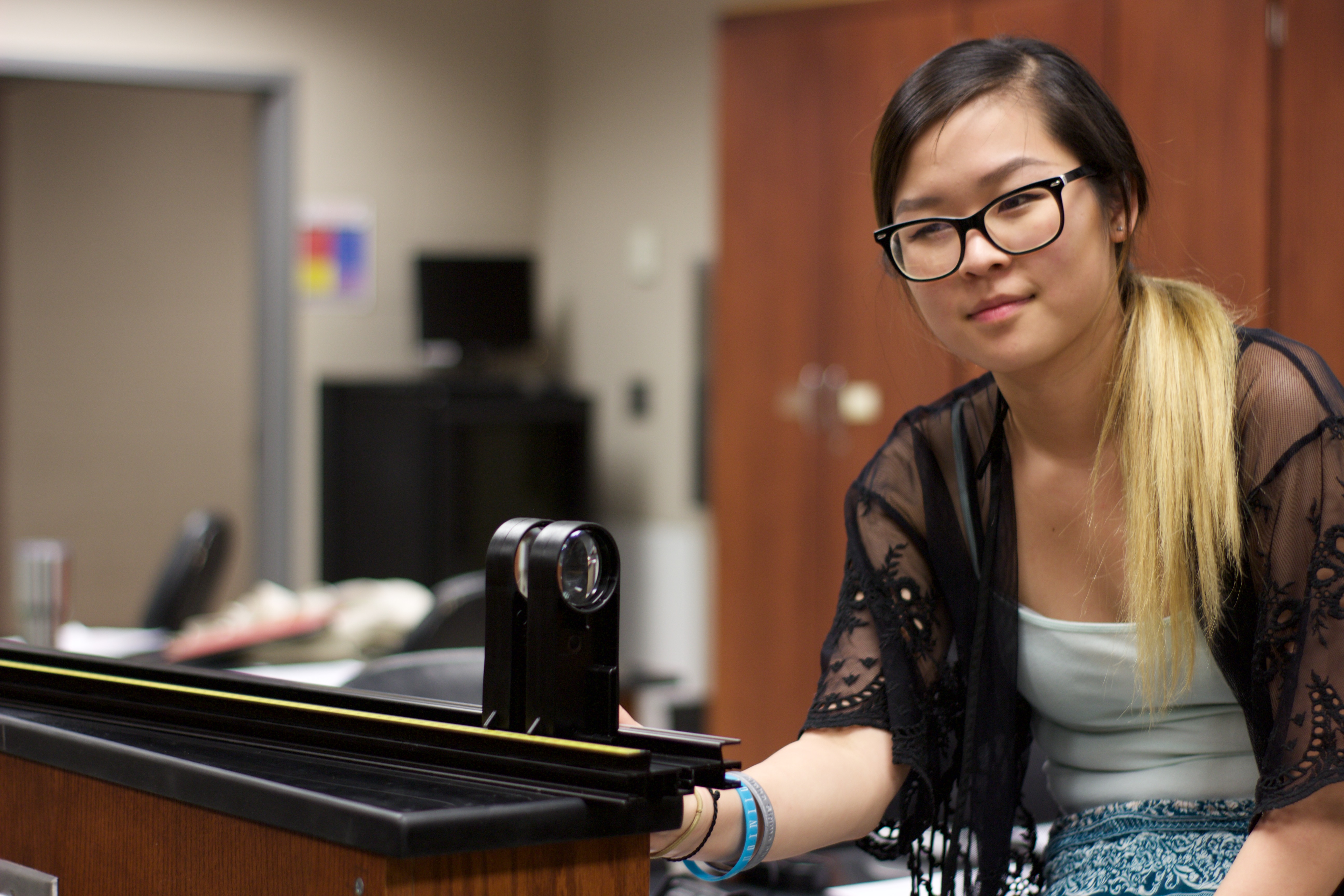 Student in Physics lab.