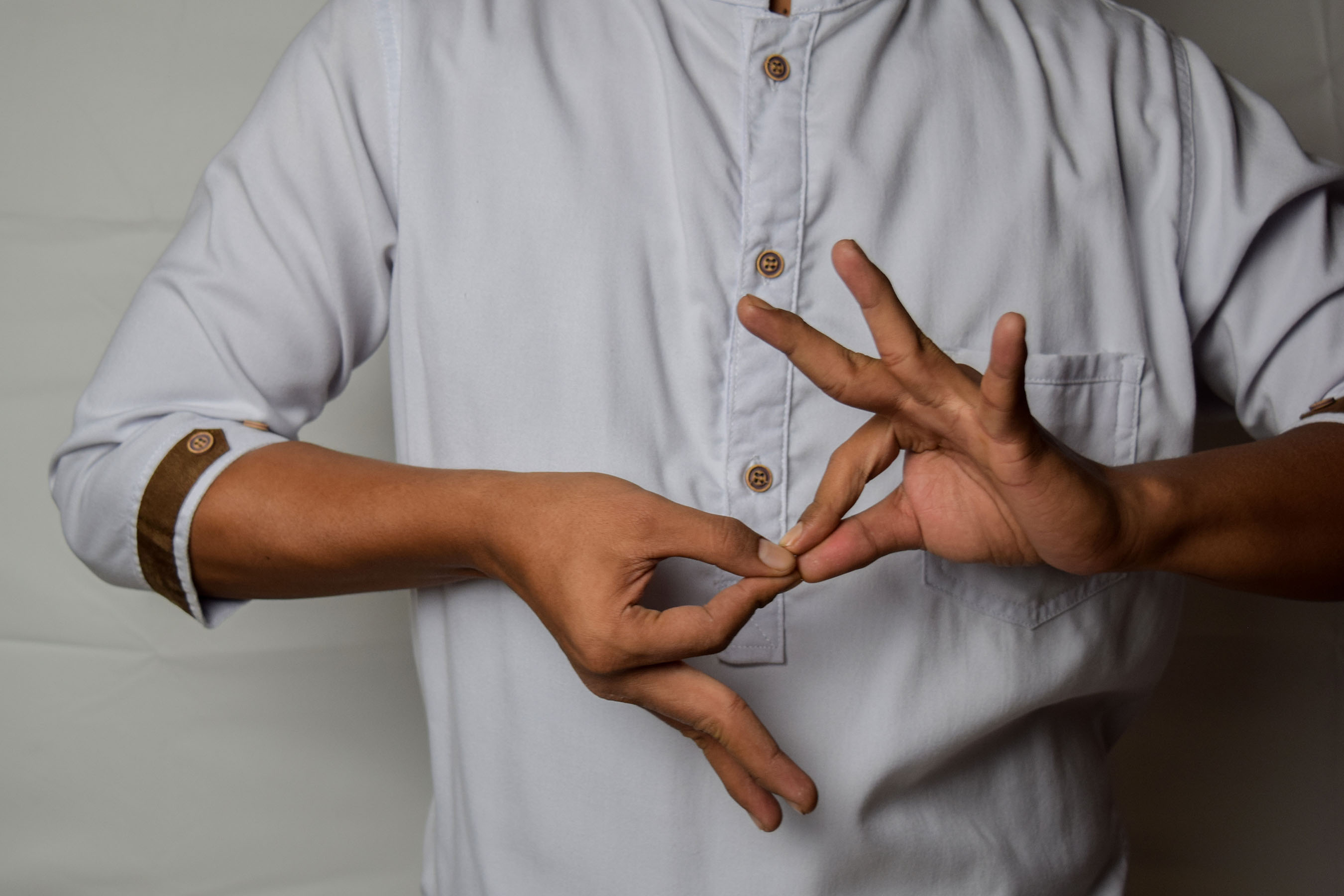 Man using sign language to communicate.