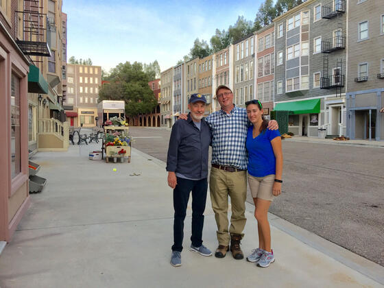 Hollywood producer Jim Wilberger ’72 (left) with his former intern and production assistant Tricia Meola ’15 (right) and Communication & Cinema professor Jonathan Slade ’88 (center) during a tour of his studio in L.A. in 2016.