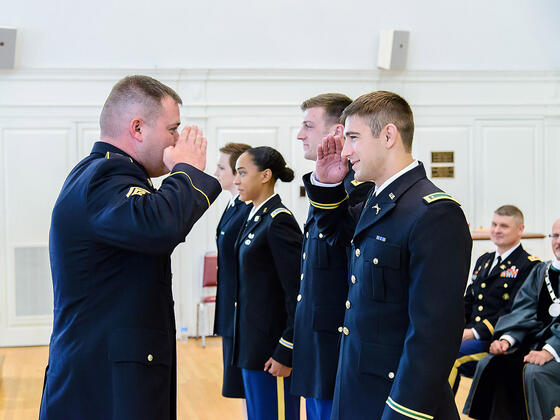 Army ROTC saluting each other.