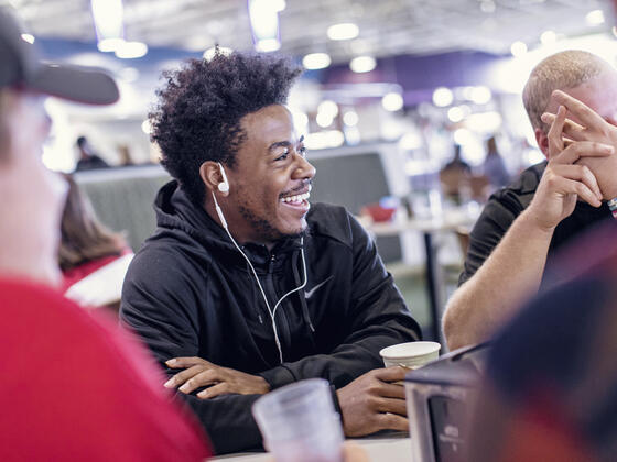 Students in conversation at table in Englar Dining Hall.