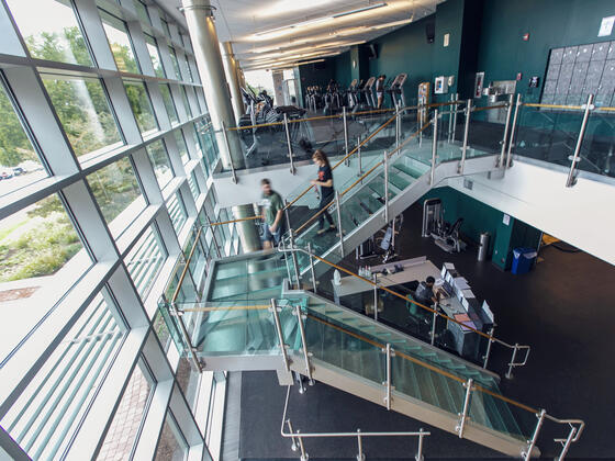 Students on staircase in Merritt Fitness.