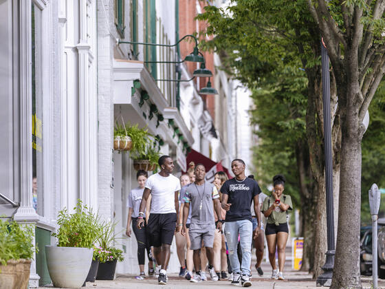 Students walking around downtown Westminster during McDaniel Local.