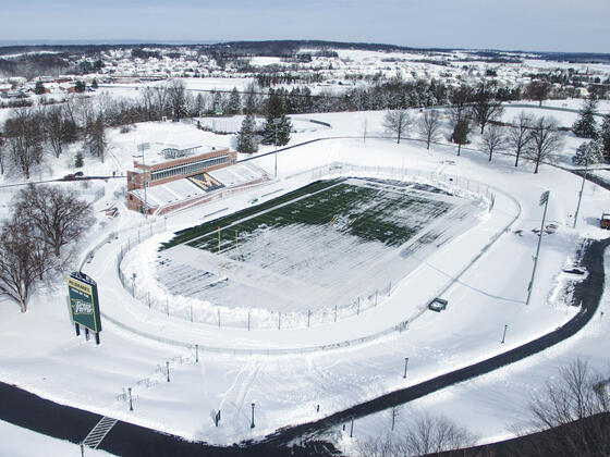 Aerial photo of McDaniel College football stadium covered in snow.