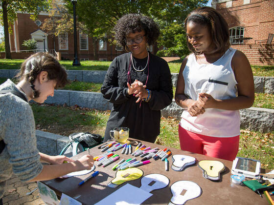 Students making Global Climate Change Week Light Switch Art