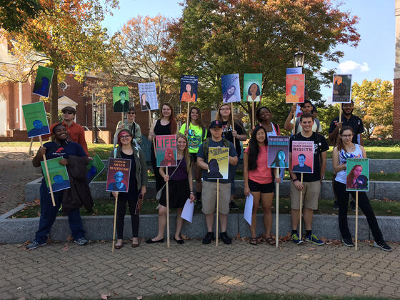 Students holding election signs.