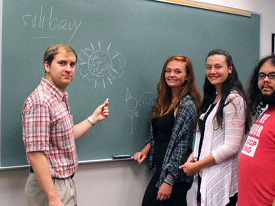 English professor Paul Zajac (left) discusses similarities between “Game of Thrones” and Shakespeare’s plays to students Jacie Wood, Kat Pensabene and Dominic Giuliani. 