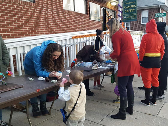 Students and kids dressed in costumes for the STEM Halloween.