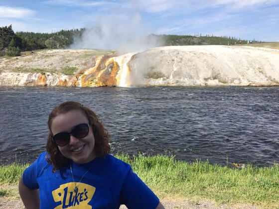 McDaniel College alumna Melissa Fry '17 stands during her internship in Yellowstone National Park's Midway Geyser Basin.