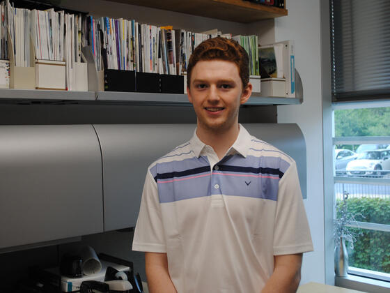 Cooper Hostetler standing in front of files.