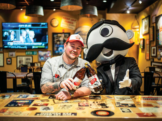 Christopher Molloy, National Bohemian brand manager, and Boh, the mascot