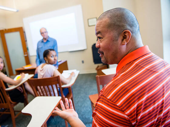 Grad students in classroom.