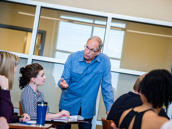 Grad students in classroom.