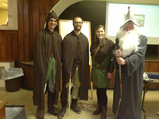 Psychology professor Paul Mazeroff with students presenting on Tolkien's Lord of the Rings