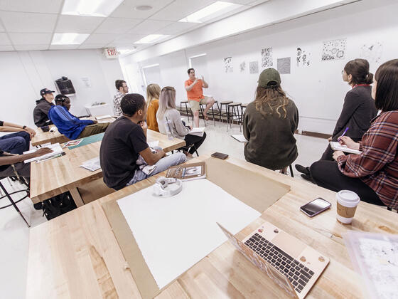 Art professor and students in art studio.