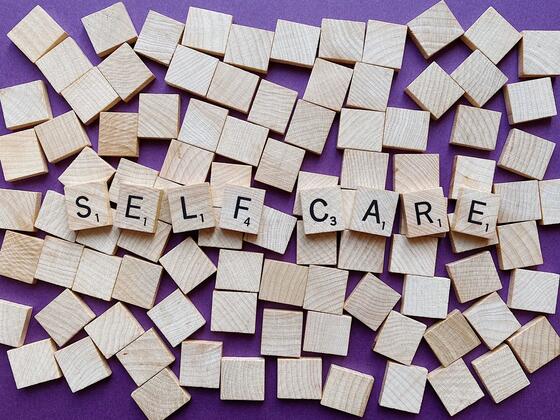 Self care graphic with scrabble tiles