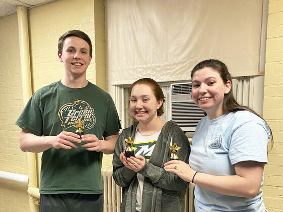 McDaniel junior Zachary Ruggerie, left, with fellow students Anna Petenbrink, center, and Laura Midkiff, right.