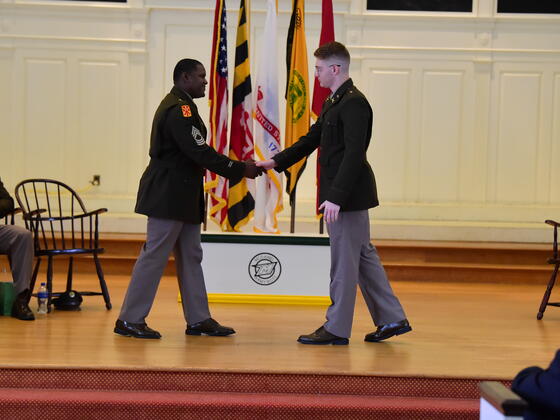 Christopher Garnsey shakes hands at ROTC Commissioning. 