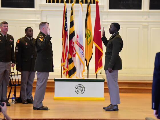 Jonathan Jacobs salutes at 2022 ROTC Commissioning.