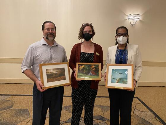 Engle poses with her AESS award between two other awardees.