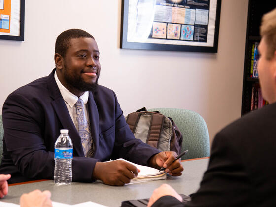 Student sitting in an interview.