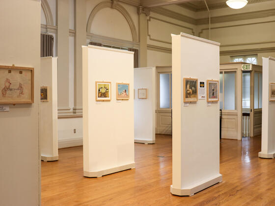 Image of free-standing gallery walls with animation artwork on them in McDaniel's Rice Gallery. 