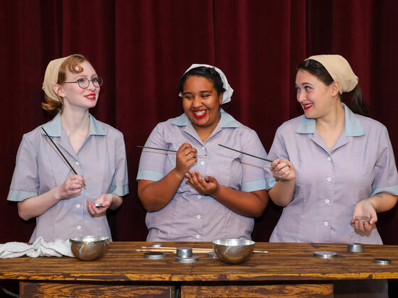 Margaret Riekenberg as Grace, Laisha Monteiro as Kathryn, and Madison Dehais as Irene in McDaniel College’s production of “Radium Girls.” 