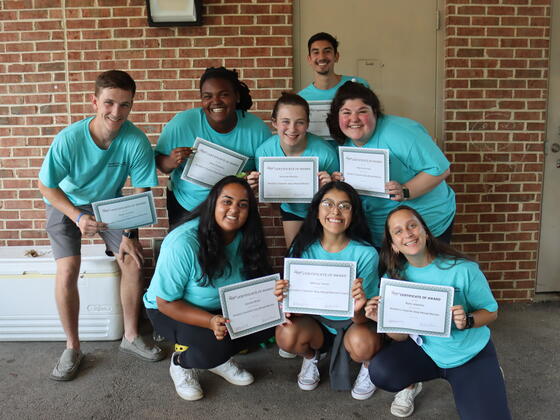 A group of people in blue 