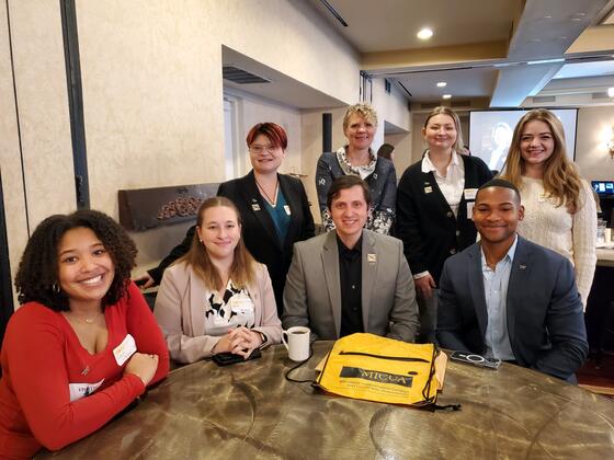Students at an event with the President of McDaniel College.