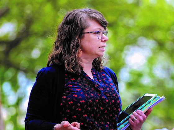 Photo of professor Katie Staab in profile standing outside.