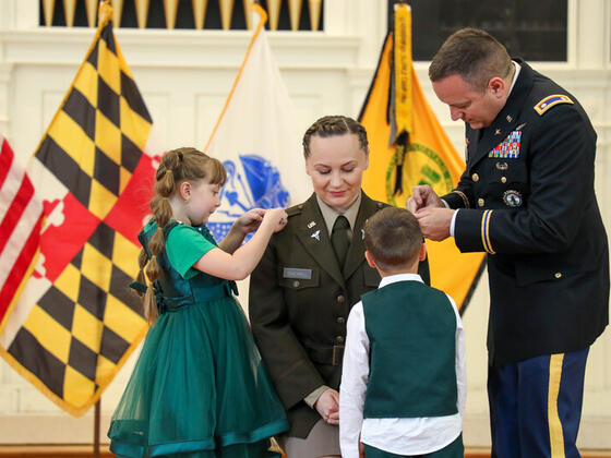 Photo of Lavinia Sherrill at Commencement with her husband and two children.