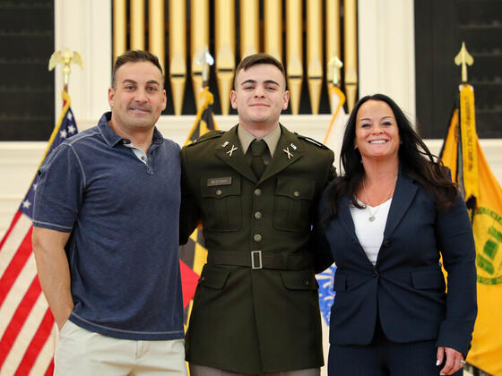 Brandon Bestany at Commissioning with his parents.