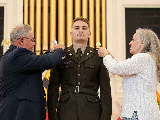 Nathan Biddle at Commissioning with his parents.
