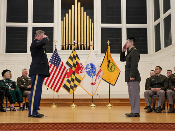 Josh Petruzzelli saluting at Commissioning.