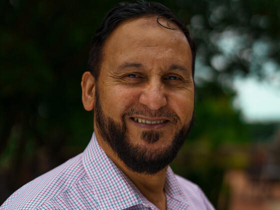 Farid Hallouche smiles on the McDaniel College campus.
