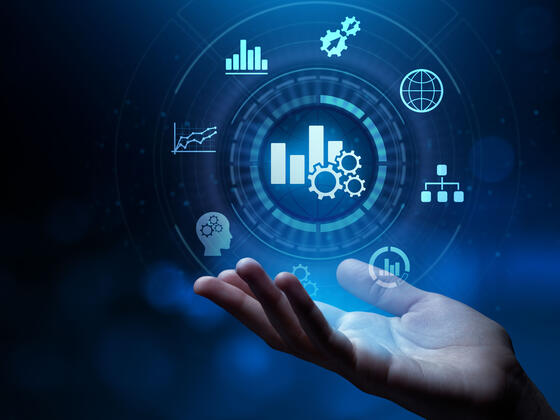 Symbols of different types of data hover above an outstretched hand.