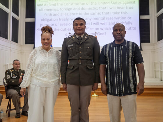 Ezekiel Gayle stands with his parents.