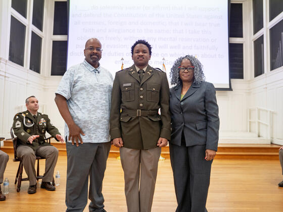 Michael Patterson stands with his parents.