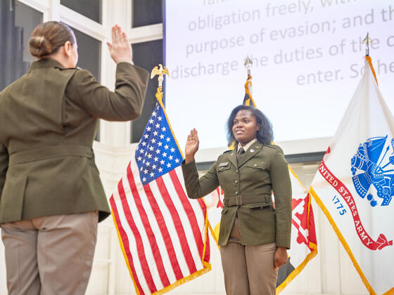 A female cadet takes the Oath of Office.